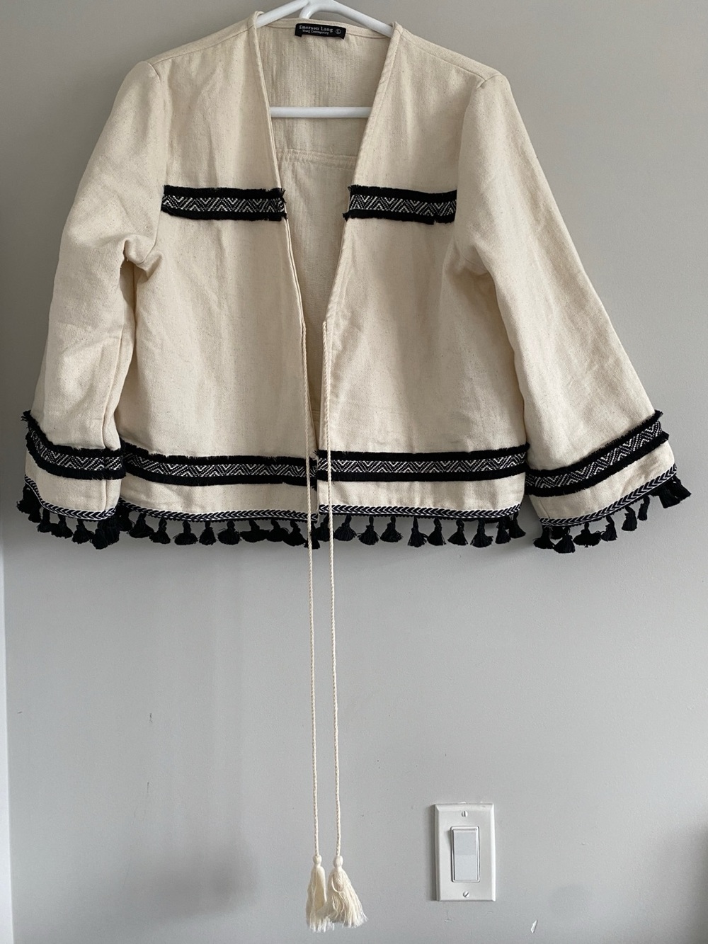 Emerson Lang, Young contemporary Cream Open Jacket with Black Tassel Trim